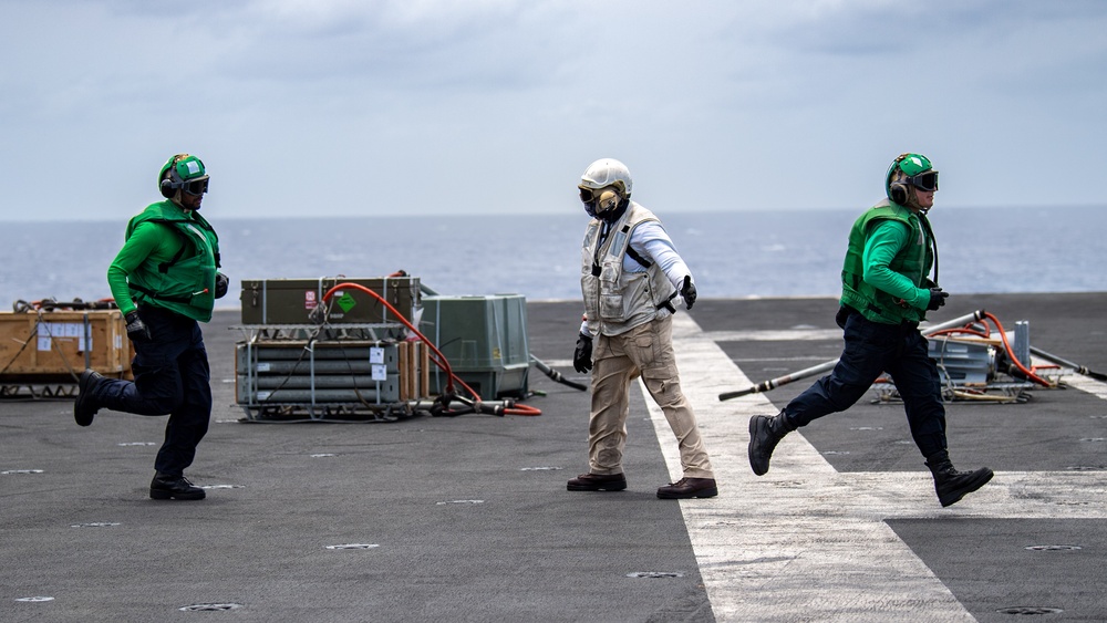 USS Ronald Reagan (CVN 76) conducts replenishment-at-sea with USNS Yukon (T-AO 202) and USNS Carl Brashear (T-AKE 7)