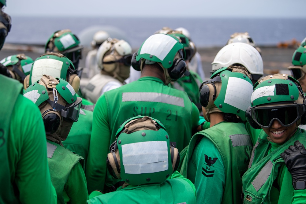 USS Ronald Reagan (CVN 76) conducts replenishment-at-sea with USNS Yukon (T-AO 202) and USNS Carl Brashear (T-AKE 7)