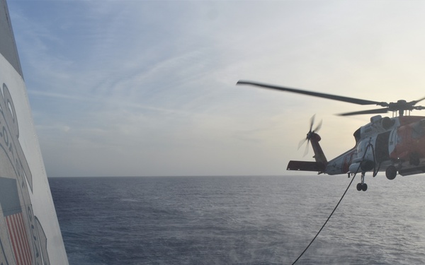 Coast Guard Cutter Resolute conducts helicopter in-flight refuel