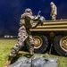 Sgt.1st Class Charles Blackwell throws a sand bag