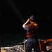 U.S. Coast Guard member conducting shoreline searches