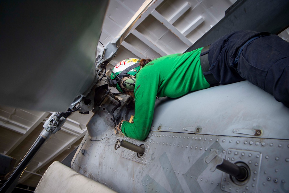 Sailor Performs Maintenance on a MH-60S Sea Hawk Aboard USS Carl Vinson (CVN 70)