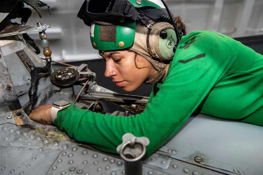 Sailor Performs Maintenance on a MH-60S Sea Hawk Aboard USS Carl Vinson (CVN 70)