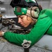 Sailor Performs Maintenance on a MH-60S Sea Hawk Aboard USS Carl Vinson (CVN 70)