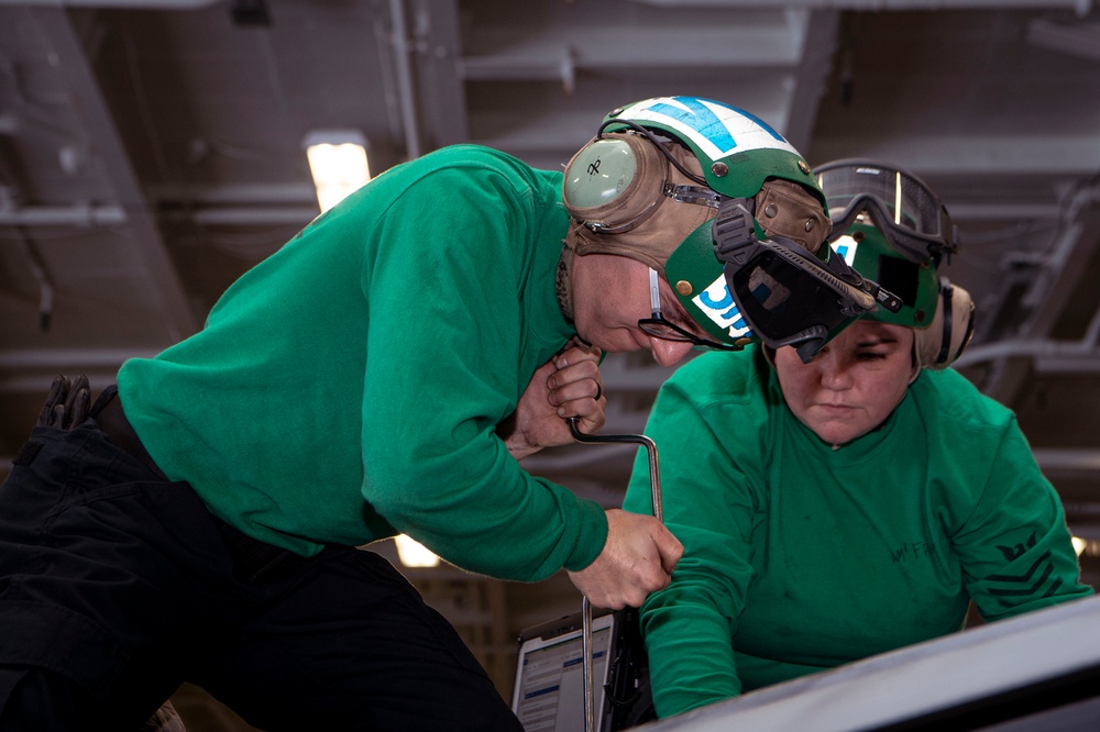 Sailors Perform Maintenance on a F/A-18E Super Hornet Aboard USS Carl Vinson (CVN 70)