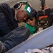 Sailors install seats on an F/A-18F Super Hornet Aboard USS Carl Vinson (CVN 70)