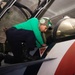 Sailor installs seats on an F/A-18F Super Hornet Aboard USS Carl Vinson (CVN 70)