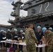 Sailors participate in a fundraising BBQ event