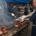 Sailors participate in a fundraising BBQ event