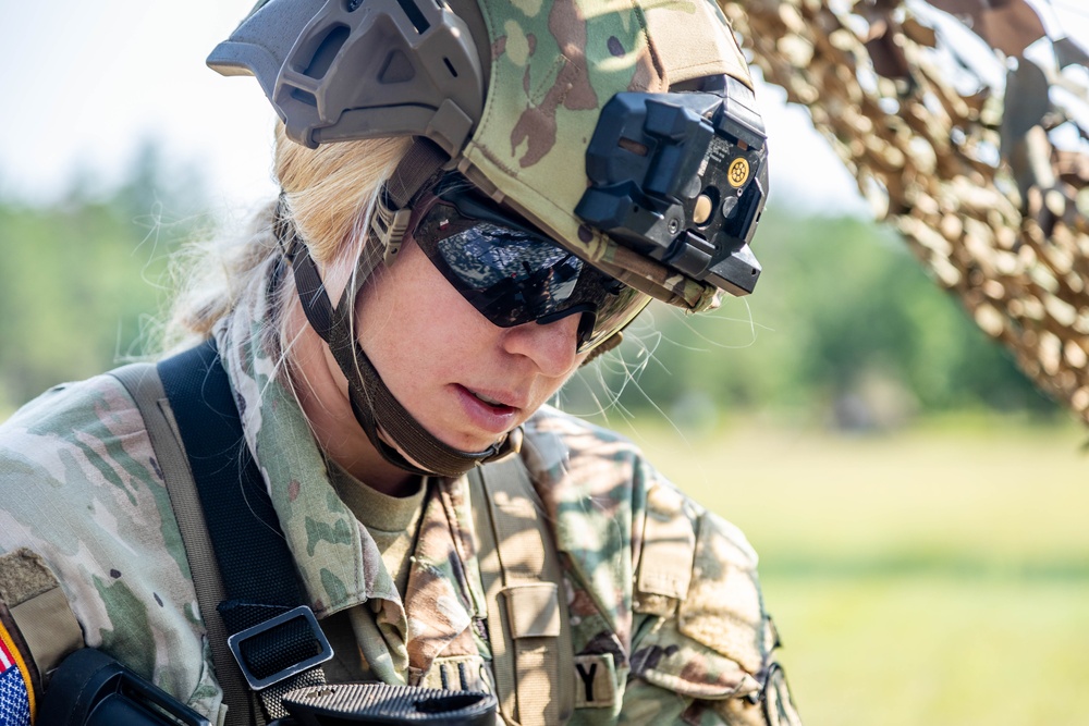 Staff Sgt. Emily Dray practices on a M26 modular accessory shotgun system