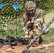 Spc. Treton Tuberosa dissassembles an M240B machine gun