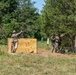 An Expert Soldier Badge candidate throws a practice grenade