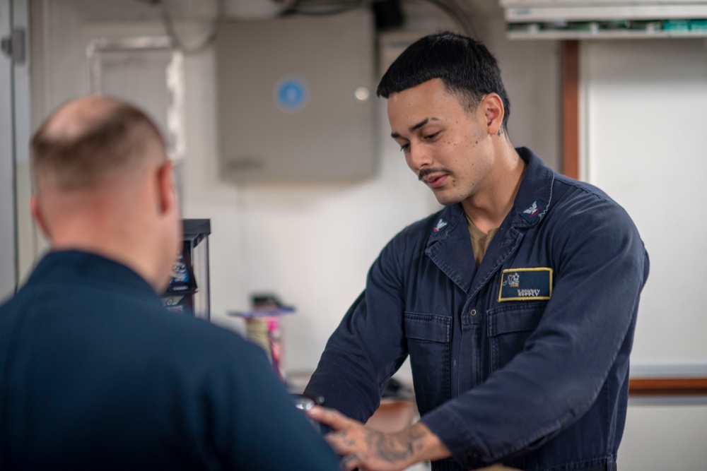 Sailor Scans Customers Merchandise