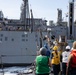 USS Ralph Johnson (DDG 114) conducts a replenishment-at-sea with the USNS Matthew Perry (T-AKE-9).