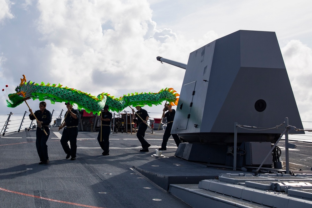 USS Ralph Johnson (DDG 114) conducts a replenishment-at-sea with the USNS Matthew Perry (T-AKE-9).