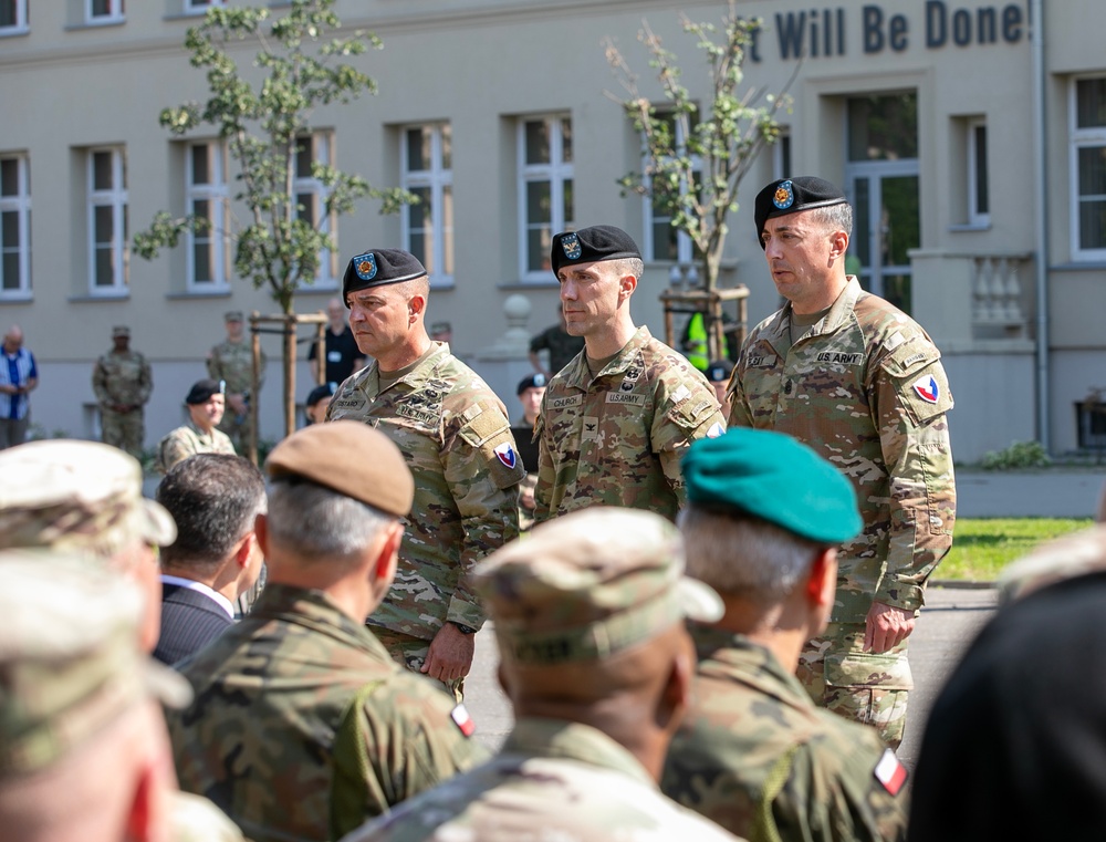 Command Sgt. Maj. Kirk L. Ray accepts USAG Poland colors