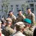 Command Sgt. Maj. Kirk L. Ray accepts USAG Poland colors