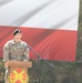 Command Sgt. Maj. Kirk L. Ray accepts USAG Poland colors