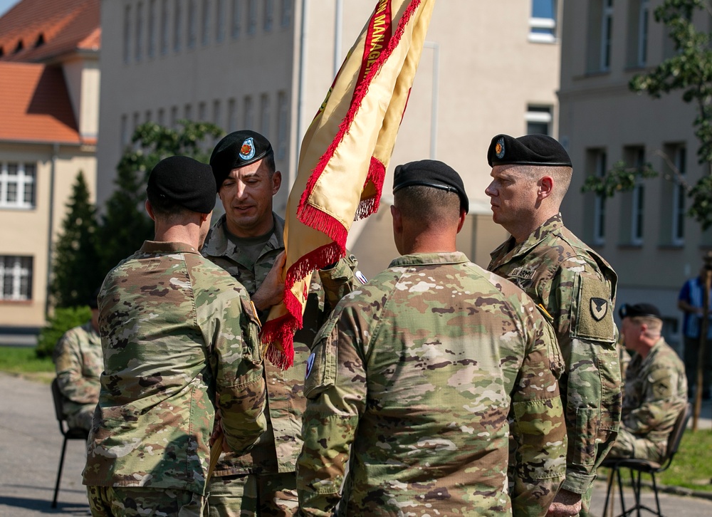 Command Sgt. Maj. Kirk L. Ray accepts USAG Poland colors