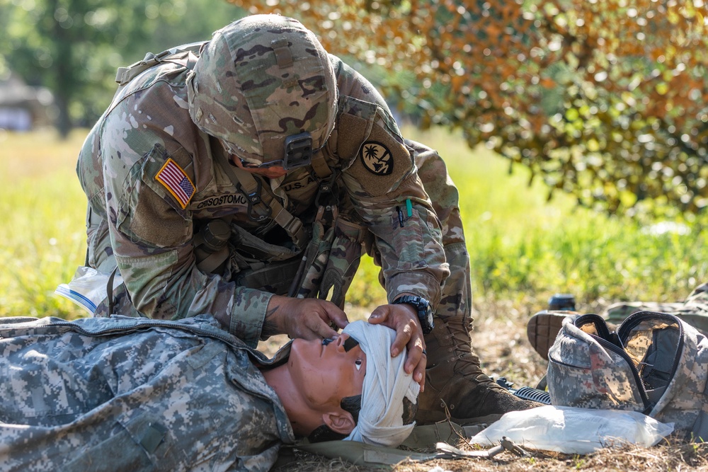 Spc. Dominic Crisostomo dresses an eye injury