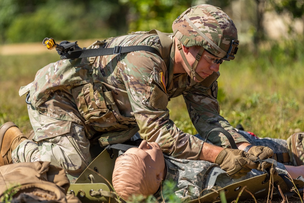 2nd Lt. Adam Ardigo secures a patient to a sled