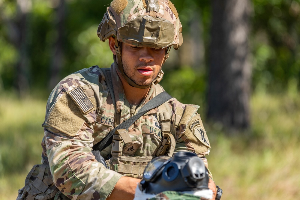 Sgt. Alexander Carrasco dresses a head wound