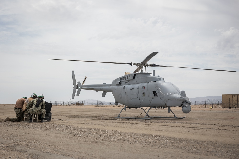 Marines and Sailors conduct ground refuel on MQ-8C Fire Scout.