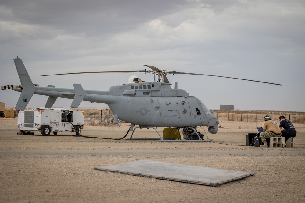 Marines and Sailors conduct ground refuel on MQ-8C Fire Scout.