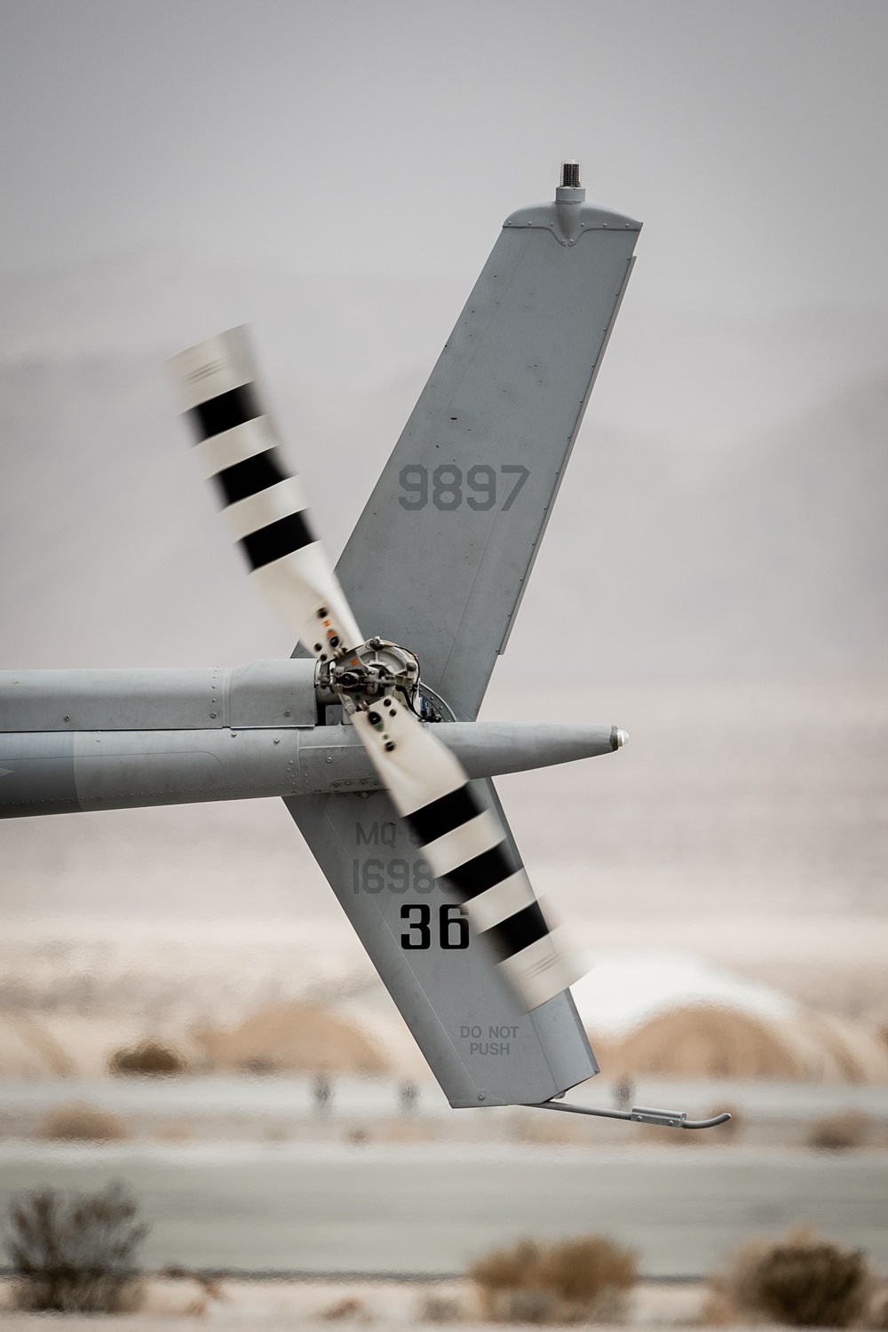 Marines and Sailors conduct ground refuel on MQ-8C Fire Scout.