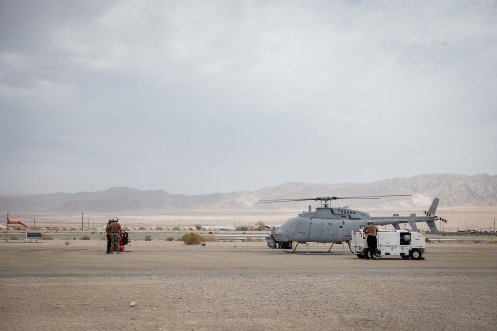 Marines and Sailors conduct ground refuel on MQ-8C Fire Scout.