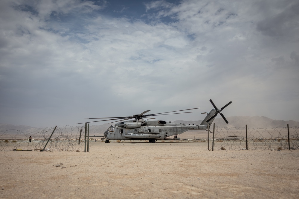 Marines and Sailors conduct ground refuel on MQ-8C Fire Scout.