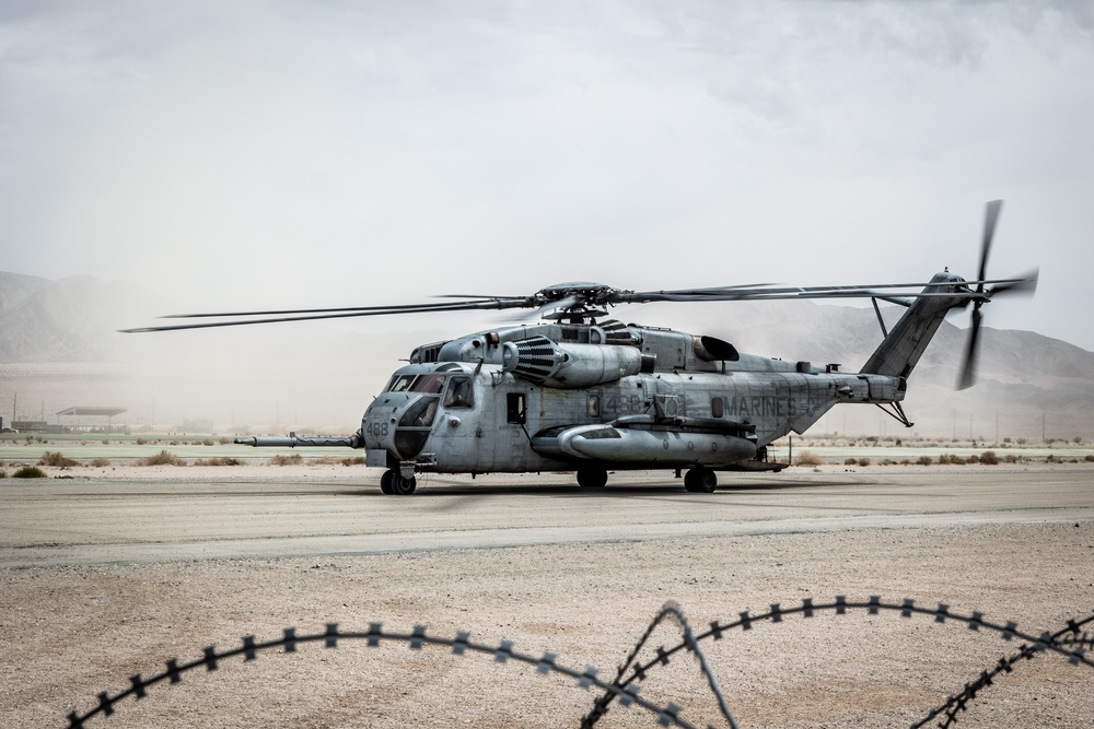 Marines and Sailors conduct ground refuel on MQ-8C Fire Scout.