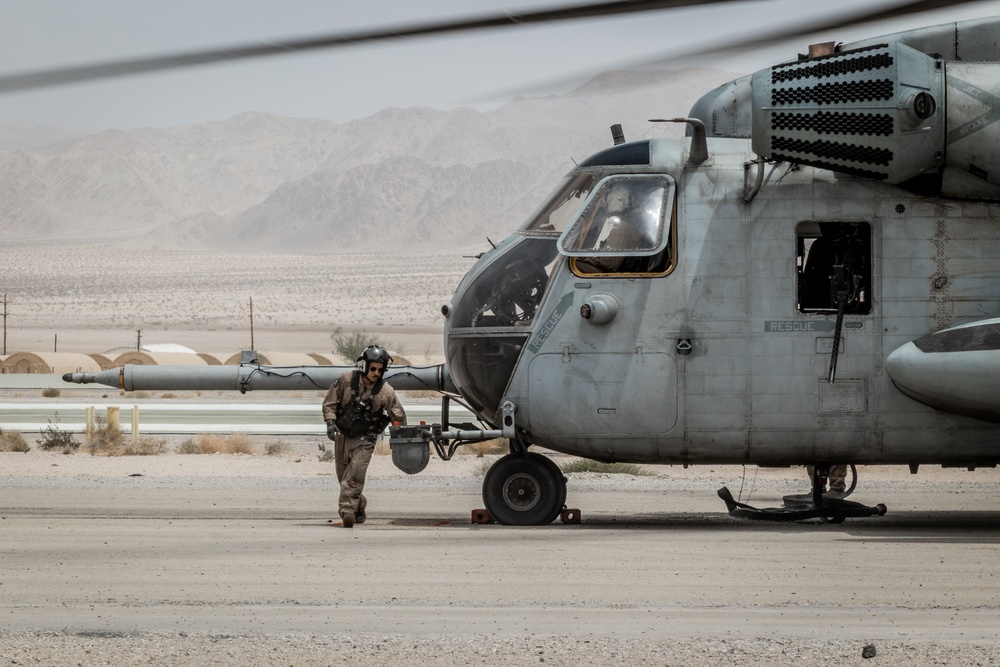 Marines and Sailors conduct ground refuel on MQ-8C Fire Scout.