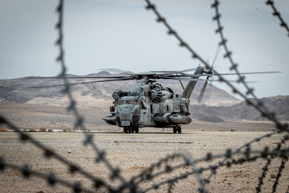 Marines and Sailors conduct ground refuel on MQ-8C Fire Scout.