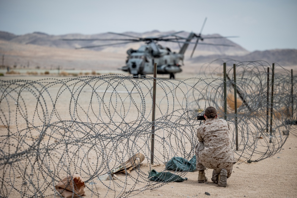 Marines and Sailors conduct ground refuel on MQ-8C Fire Scout.