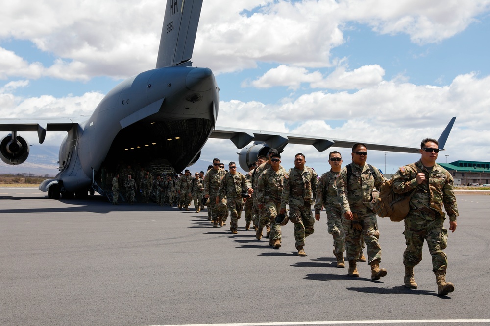 Hawaii National Guard service members arrive on a C-17 Globemaster III in support of Joint Task Force 50