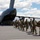 Hawaii National Guard service members arrive on a C-17 Globemaster III in support of Joint Task Force 50