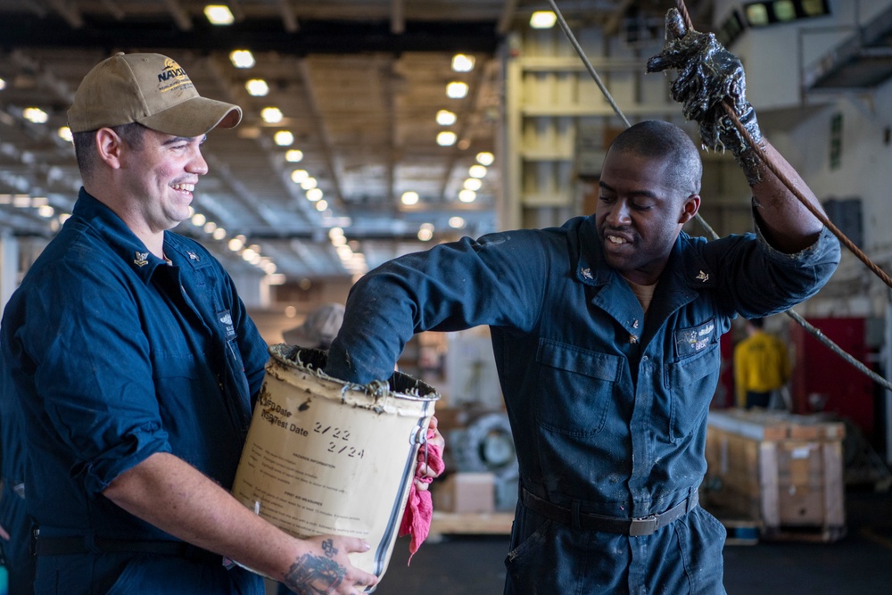 Sailor Conducts Maintenance