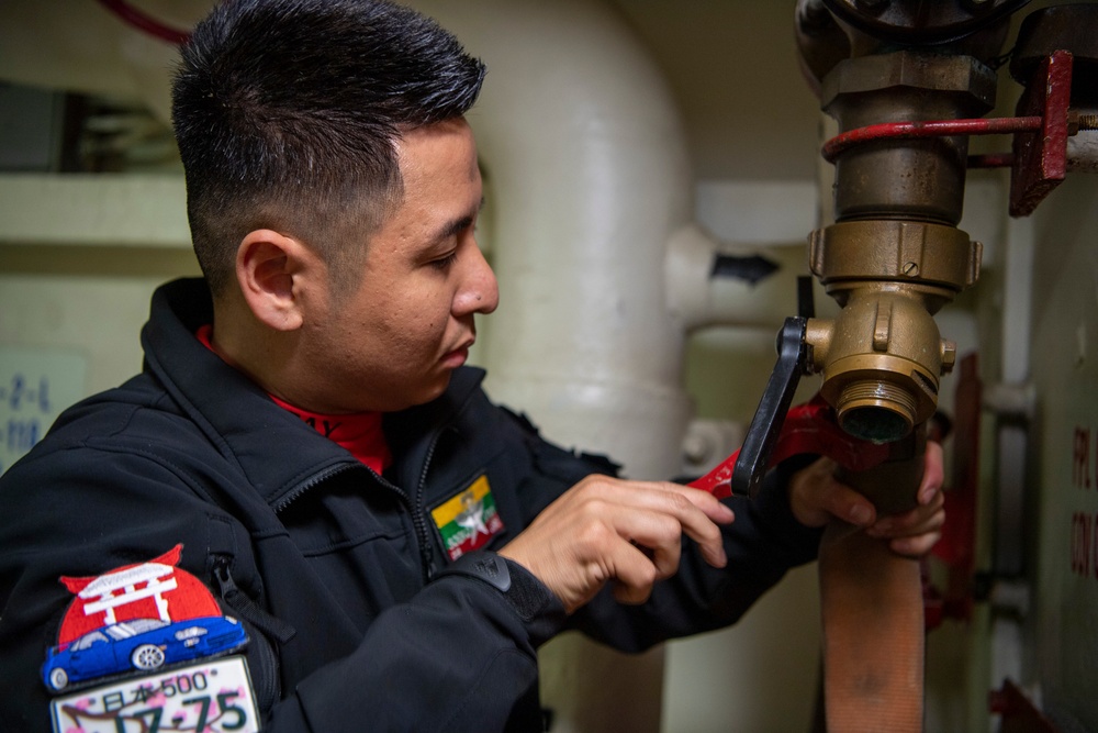 Sailor Conducts Maintenance