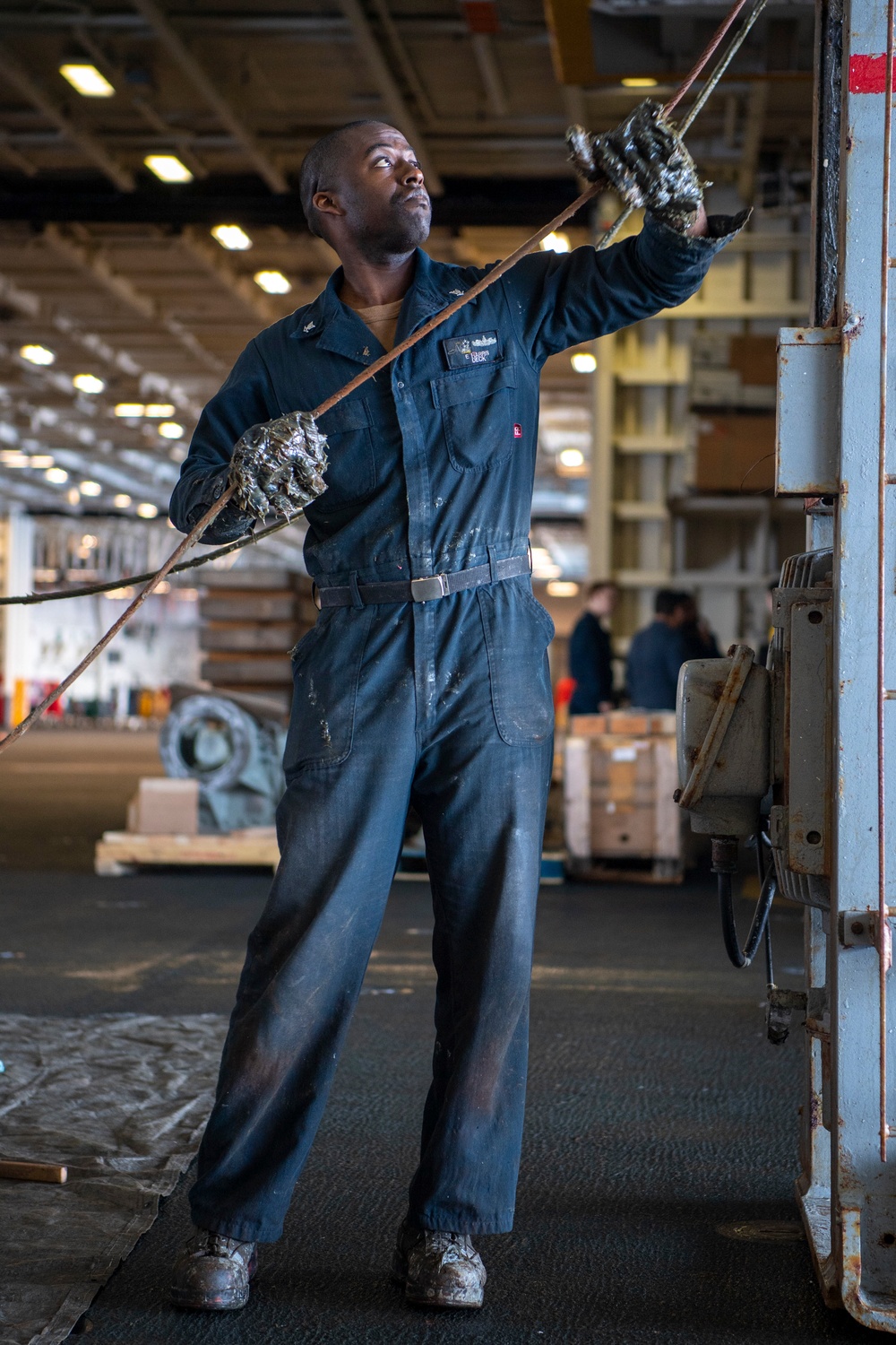 Sailor Conducts Maintenance