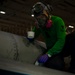 USS Carl Vinson (CVN 70) Sailor Paints a Jet