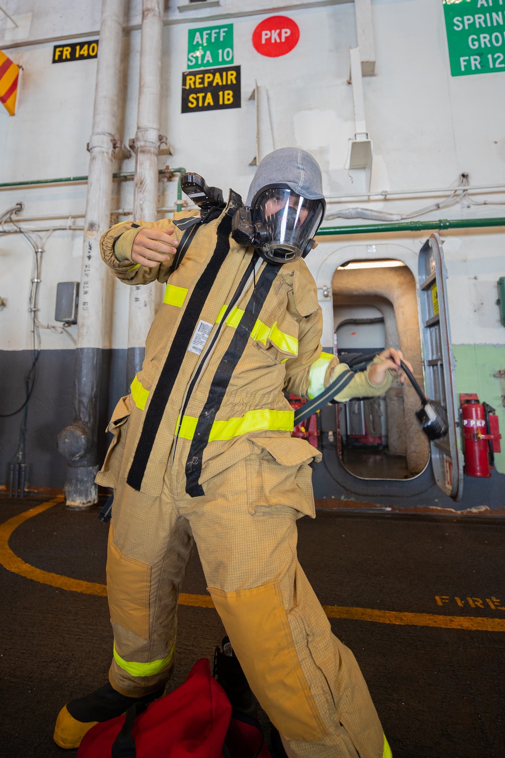 Sailors Aboard George Washington Don Firefighting Equipment