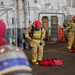 Sailors Aboard CVN 73 Don Firefighting Equipment