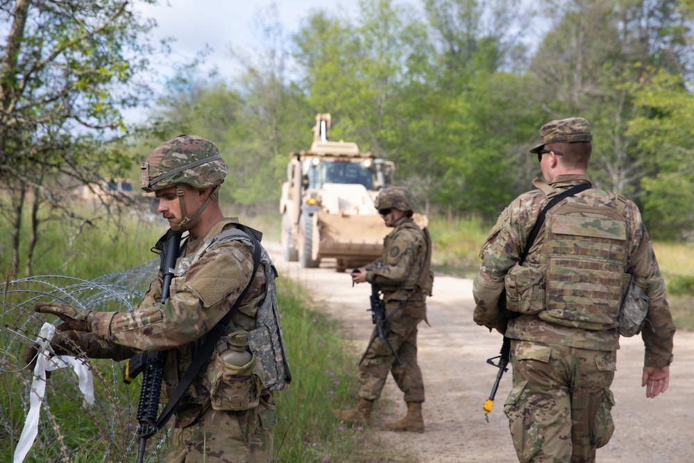 Soldiers with the 1431st Engineer Company set up a concertina wire obstacle during Exercise Northern Strike 2023