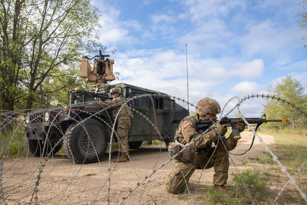 Soldiers with the 1431st Engineer Company set up a concertina wire obstacle during Exercise Northern Strike 2023