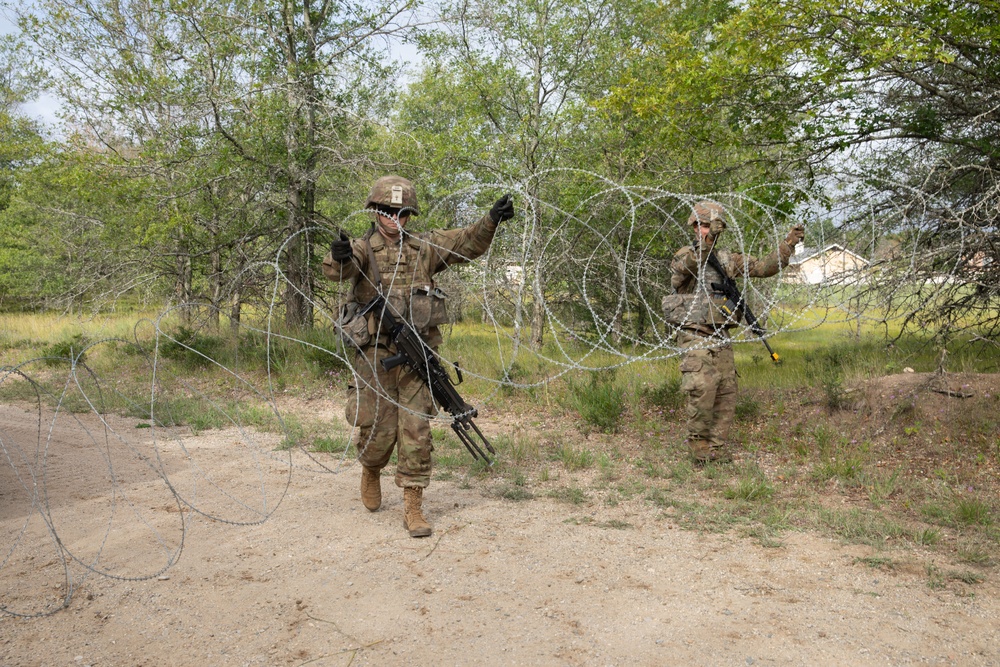 Soldiers with the 1431st Engineer Company set up a concertina wire obstacle during Exercise Northern Strike 2023