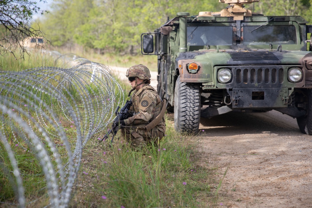 Soldiers with the 1431st Engineer Company set up a concertina wire obstacle during Exercise Northern Strike 2023