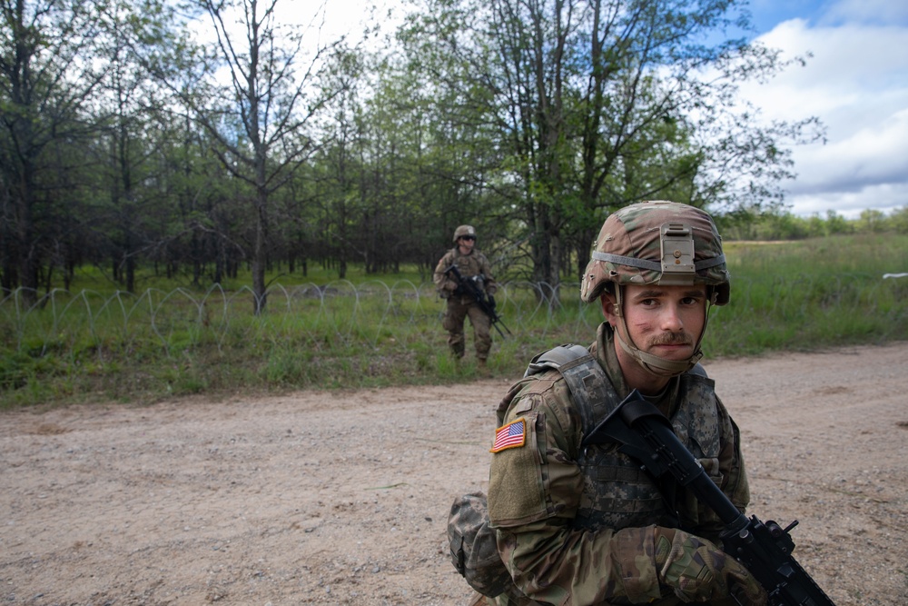 Soldiers with the 1431st Engineer Company set up a concertina wire obstacle during Exercise Northern Strike 2023