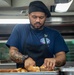USS Ronald Reagan (CVN 76) Sailors prepare and serve food