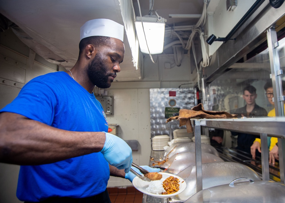 USS Ronald Reagan (CVN 76) Sailors prepare and serve food